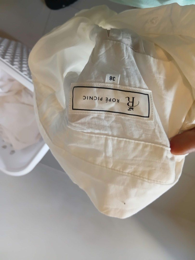 Rope Picnic White Button Down Shirt Size 38 (Category: Shirts) located in Antipolo. Submitted by wisecat.4a7eea (Listing ID 1470399818, Image 2). Description: - Brand: Rope Picnic - Color: Classic White - Size: Tagged 38, fits S to M - Details: Classic collar, front button closure, single chest pocket, long sleeves with button cuffs - Material: Lightweight, easy to style for work or casual outfits - Condition: Minor wrinkling from storage, ready 