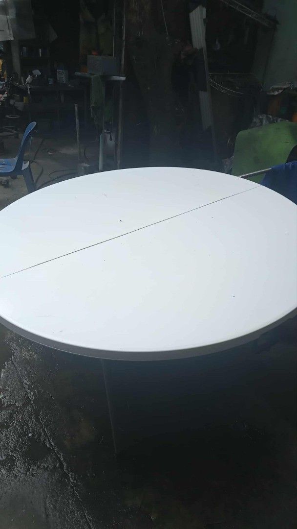 Round Foldable Plastic Event Table with Metal Frame (Category: Tables & Sets) located in Manila. Submitted by wisegem-231b (Listing ID 1470403674, Image 3). Description: - Large round folding table with a durable white plastic top and honeycombed underside structure - Secure grey metal folding legs that lock firmly into place - Conveniently folds in half with a built-in carrying handle for effortless transport and compact storage - Ideal for part