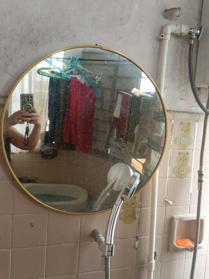 Round Gold Frame Wall Mirror Bathroom Decor (Category: Mirrors) located in Caloocan City. Submitted by maynaito (Listing ID 1470383388, Image 2). Description: - Elegant round wall mirror with a thin gold metal frame - Classic minimalist design fits any home decor theme - Provides clear reflection with sturdy frame construction - Ideal size for entryways, bathrooms, or bedrooms - Easy to hang on small and medium wall spaces.