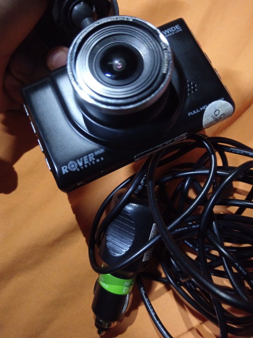 Rover Systems Dash Cam MVR RMA-A1002B (Category: Security Systems & CCTV Cameras) located in Manila. Submitted by mark2669 (Listing ID 1470541502, Image 3). Description: - Brand/Model: Rover Systems MVR RMA-A1002B Dash Camera (Black) - Resolution: Full HD video recording for clear evidence and driving security - Lens: Wide-angle lens to capture more of the road - Inclusions: Suction mount bracket and long car cigarette lighter power cable - Condi