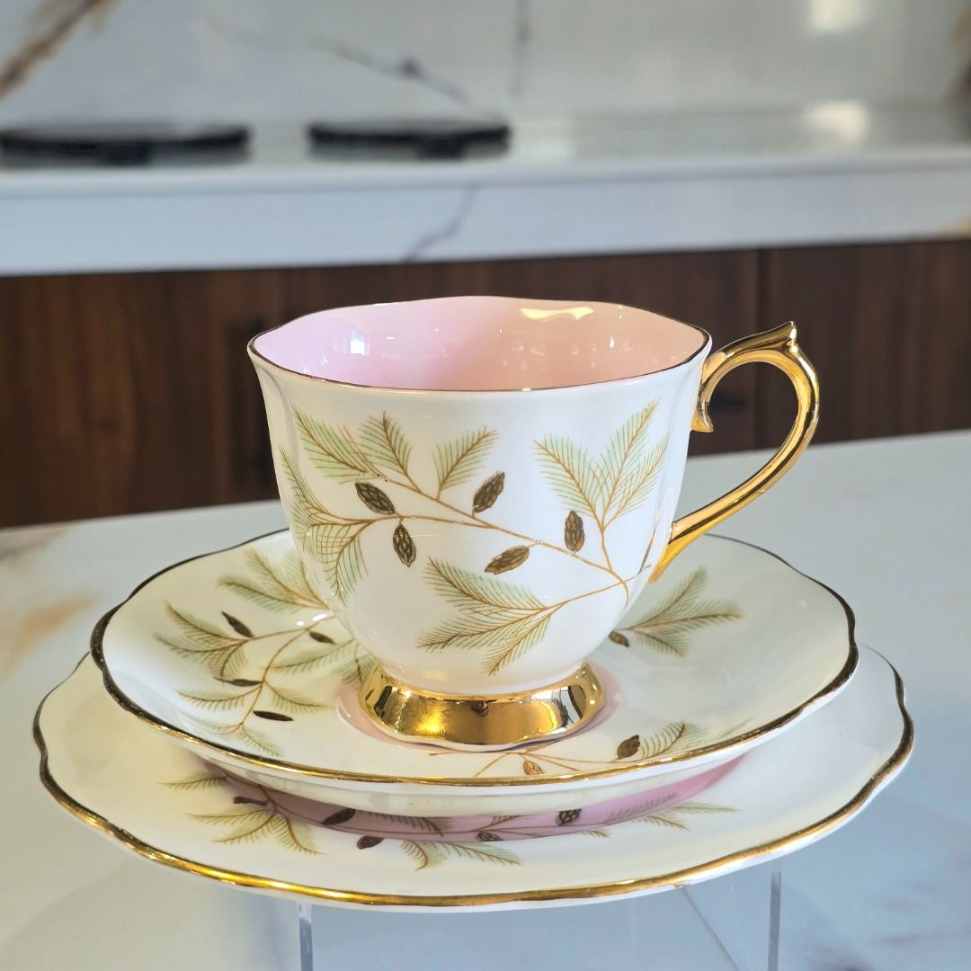 Royal Albert Braemar Bone China Tea Trio (Category: Coffee & Tea Tableware) located in Compostela. Submitted by curatedcabinetcebu (Listing ID 1470543183, Image 1). Description: - Authentic Royal Albert Braemar tea trio (teacup, saucer, and side plate) - Crafted from fine English bone china with official bottom stamp - Features a delicate pine branch pattern in green and brown - Elegant gold trim on scalloped edges, handle, and base - Charming so