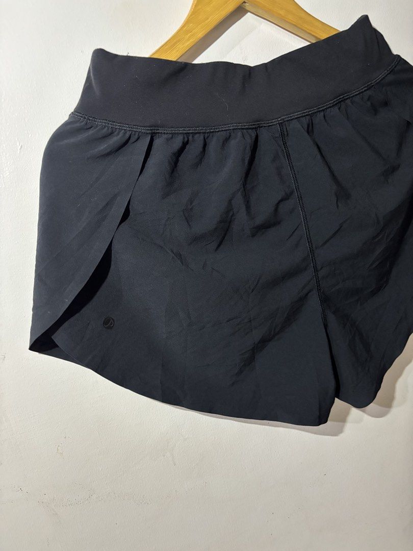 Running split shorts (Category: Shorts) located in Kalibo. Submitted by mack29 (Listing ID 1470351640, Image 3). Description: Size 30 to 32 - Color: Classic Black - Fit: High-rise waistband for extra support and comfort - Mobility: Split leg hem designed for easy movement - Fabric: Lightweight and breathable, ideal for workouts, runs, or daily wear - Detail: Subtle signature Lululemon logo on the left leg.
