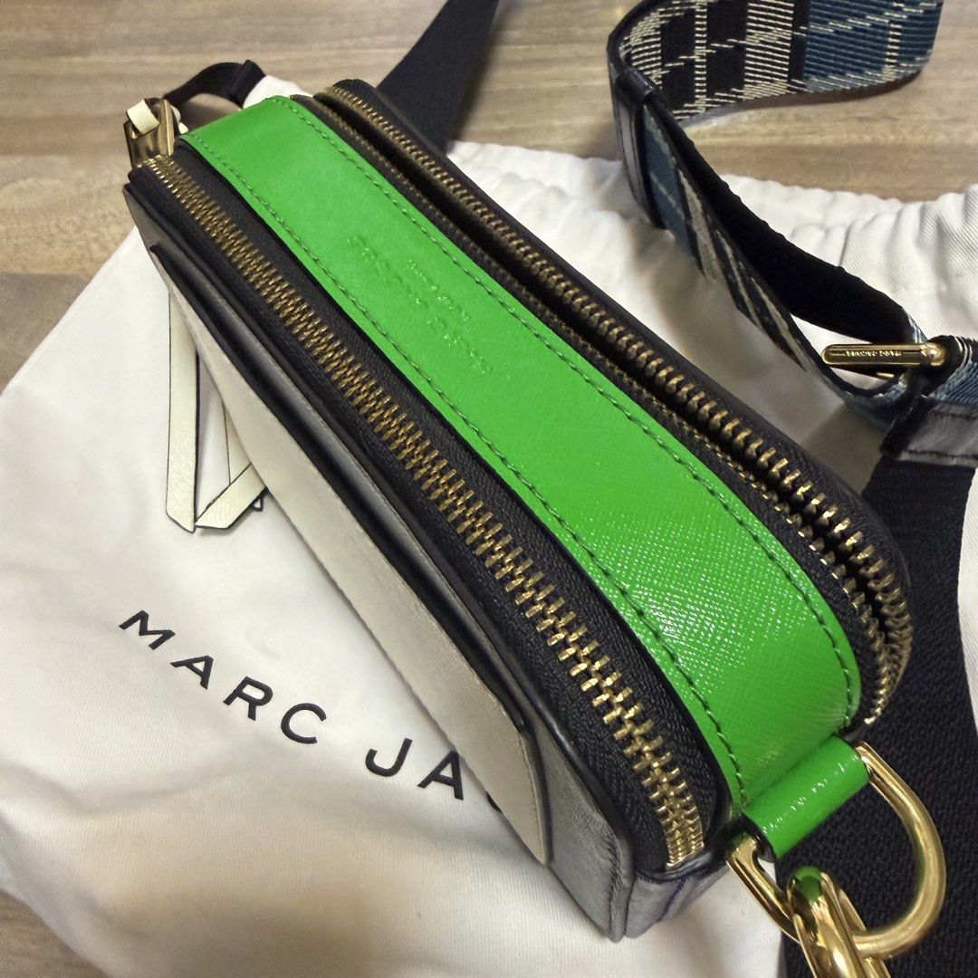 RUSH Marc Jacobs Snapshot Camera Bag Multi-Color (Category: Luxury Bags & Wallets) located in Quezon City. Submitted by bmason0408 (Listing ID 1470389177, Image 2). Description: - Multi-color Marc Jacobs Snapshot camera bag. - Grey front and back, bright green top gusset, blue side panels, white accent pocket patch on reverse. - Gold hardware - Thick strap in blue, black, and white plaid - Includes white dust bag - Compact crossbody style with do