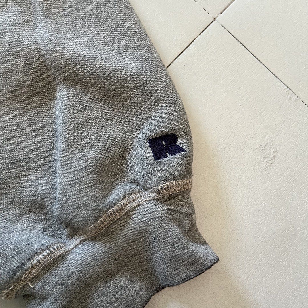 Vintage Russell Athletic Team Issue Grey Sweatshirt (Category: Coats, Jackets and Outerwear) located in Cabuyao City. Submitted by ricomalic (Listing ID 1470503784, Image 2). Description: Thrifted/preloved Russell Athletic Team Issue crewneck sweatshirt. Classic gray color, perfect for vintage and streetwear fits. Condition: Has small stains, visible wear, and damaged/frayed stitching near the sleeve cuff and seams. Please check photos for actual