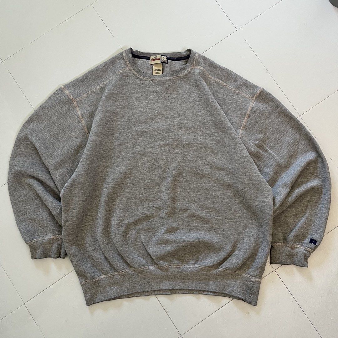 Vintage Russell Athletic Team Issue Grey Sweatshirt (Category: Coats, Jackets and Outerwear) located in Cabuyao City. Submitted by ricomalic (Listing ID 1470503784, Image 1). Description: Thrifted/preloved Russell Athletic Team Issue crewneck sweatshirt. Classic gray color, perfect for vintage and streetwear fits. Condition: Has small stains, visible wear, and damaged/frayed stitching near the sleeve cuff and seams. Please check photos for actual
