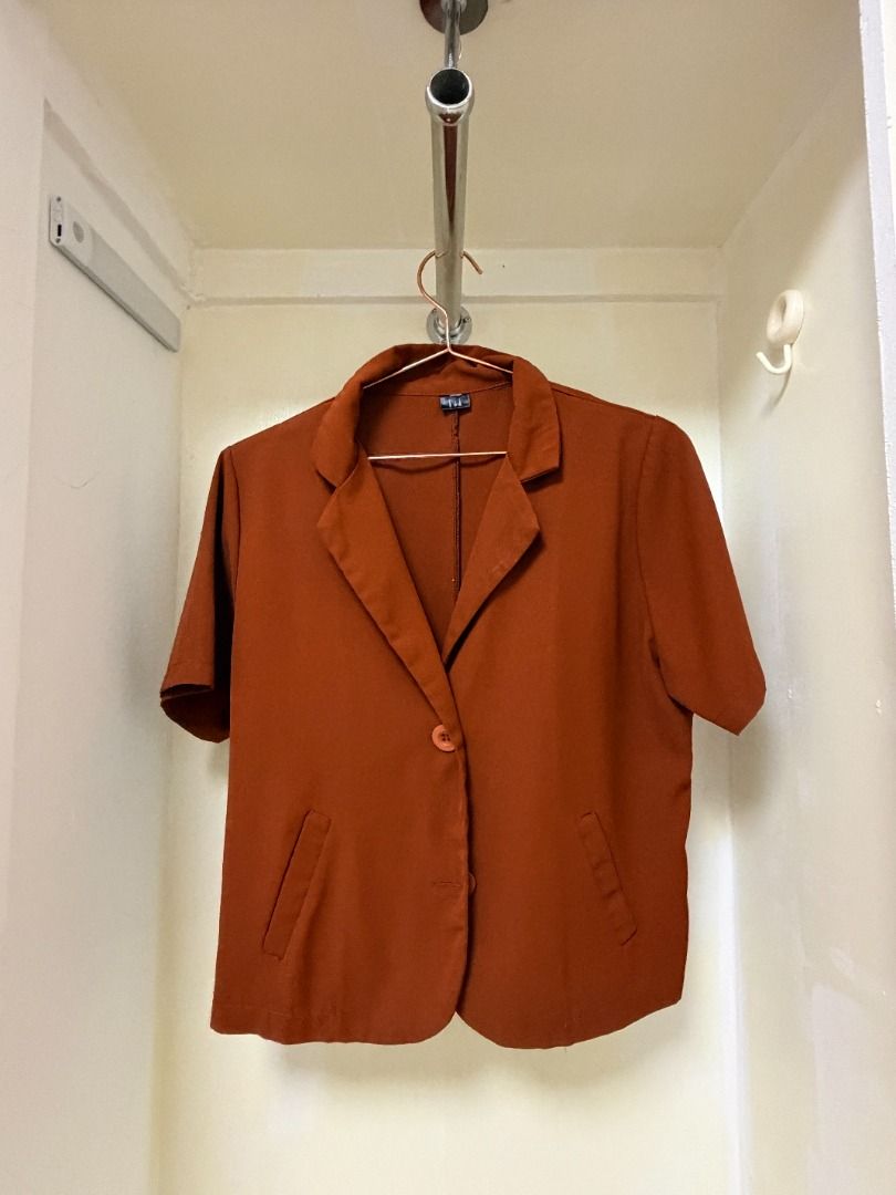 Rust Orange Short Sleeve Blazer with Front Pockets (Category: Coats, Jackets and Outerwear) located in Makati City. Submitted by yuriandcole (Listing ID 1470377877, Image 1). Description: - Color: Rust orange - Style: Short sleeve blazer with lapel collar - Closure: Single front button - Pockets: Two front welt pockets - Material: Lightweight and comfortable - Versatile: Great for office wear, meetings, or smart casual outfits.