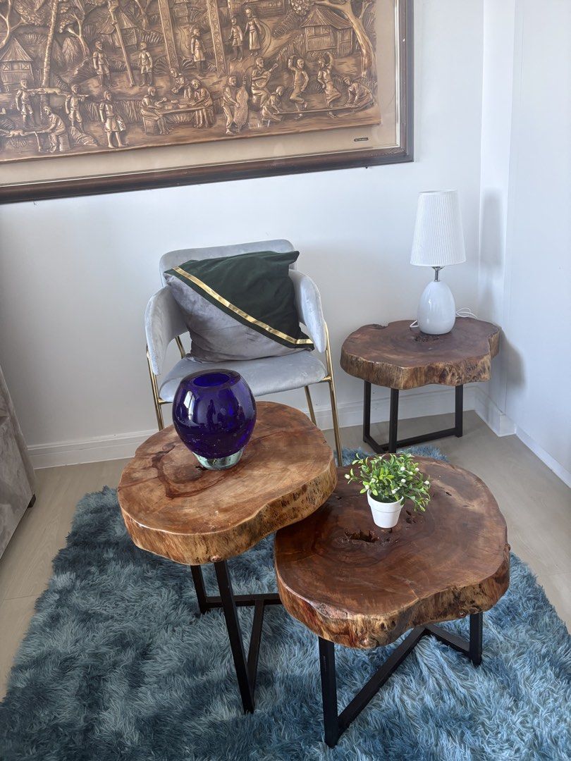 Rustic Live Edge Wood Coffee Table Set Nesting Tables (Category: Tables & Sets) located in Pasig City. Submitted by casambhomedecors (Listing ID 1470393293, Image 3). Description: - Set of 3 nesting coffee tables with unique natural live edge wood slabs - Features stunning natural wood grain patterns on every top - Built with sturdy black metal legs for solid construction and stability - Versatile design: nest them together or place them separate