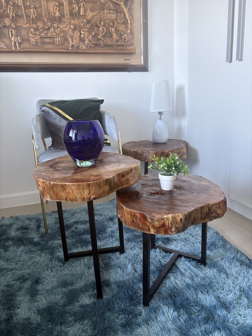 Rustic Live Edge Wood Coffee Table Set Nesting Tables (Category: Tables & Sets) located in Pasig City. Submitted by casambhomedecors (Listing ID 1470393293, Image 2). Description: - Set of 3 nesting coffee tables with unique natural live edge wood slabs - Features stunning natural wood grain patterns on every top - Built with sturdy black metal legs for solid construction and stability - Versatile design: nest them together or place them separate