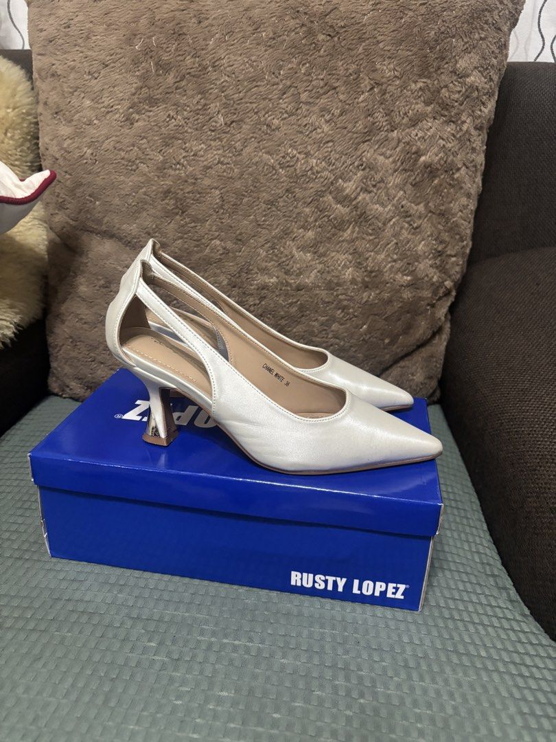 Rusty Lopez Chanel White Heels Size 36 (Category: Heels) located in Binan City. Submitted by kpreloved___ (Listing ID 1470405810, Image 2). Description: Bridal Shoes Brand: Rusty Lopez - Color: Chanel White, satin finish - Size: 36 - Style: Pointed toe with slingback strap and flared heel Bought for ₱1799 - Condition: Worn once for a wedding ceremony (2hrs) - Inclusions: Original blue shoebox.