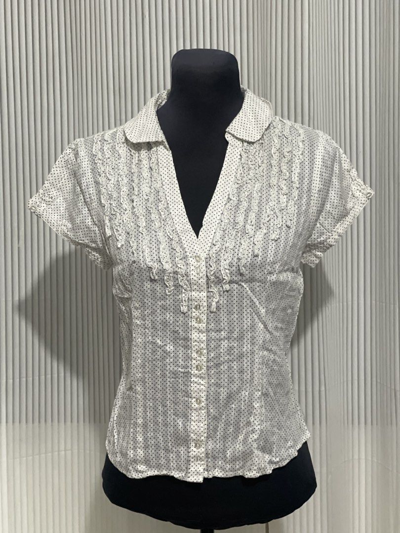 RW & Co. White Suble Dot Design Polo Top (Category: Others Tops) located in Tuguegarao City. Submitted by ziggerryy (Listing ID 1470516676, Image 2). Description: No flaws. No holes Fits S-M *white short-sleeve button-front blouse featuring a subtle dot pattern, a classic collar, and delicate vertical ruffle trims along the placket.* .