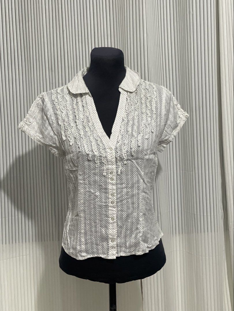 RW & Co. White Suble Dot Design Polo Top (Category: Others Tops) located in Tuguegarao City. Submitted by ziggerryy (Listing ID 1470516676, Image 1). Description: No flaws. No holes Fits S-M *white short-sleeve button-front blouse featuring a subtle dot pattern, a classic collar, and delicate vertical ruffle trims along the placket.* .