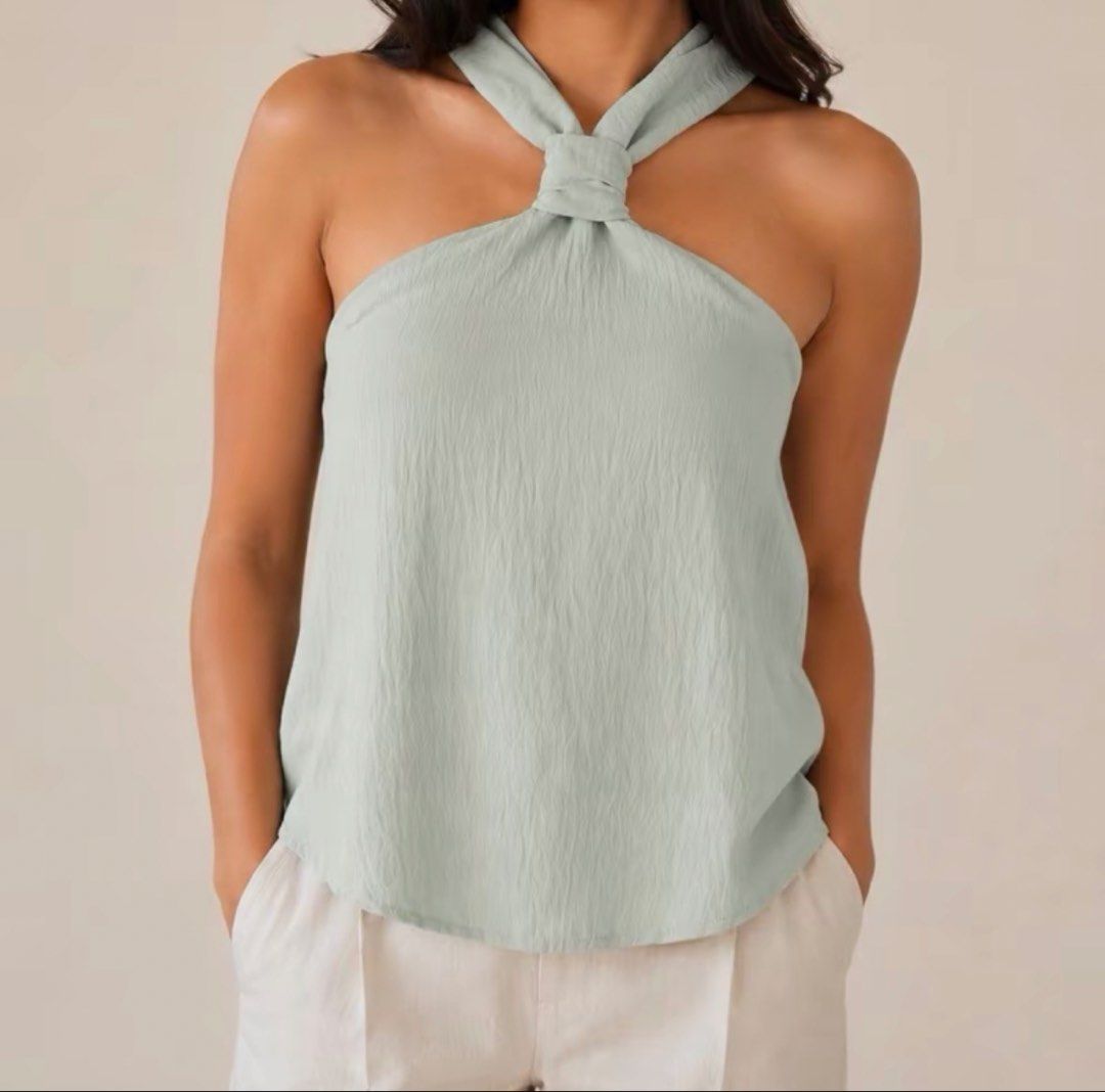 Sage green halter top (Category: Sleeveless) located in Taguig. Submitted by 4ly.finds (Listing ID 1470532232, Image 1). Description: used once kinda big for me still in great condition .
