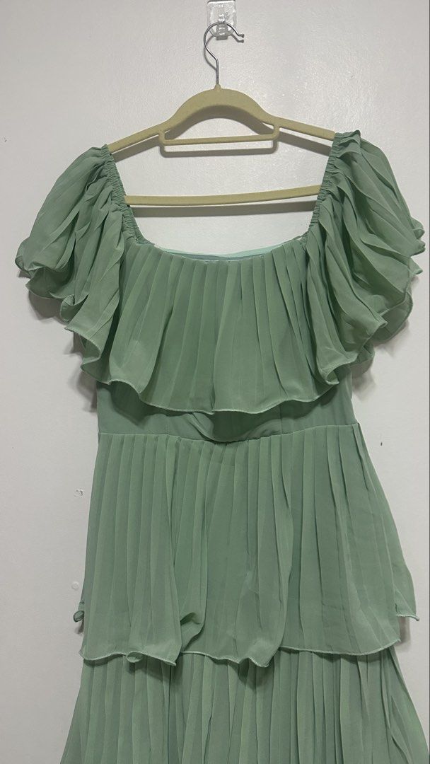 Sage Green Ruffle Dress (Category: Evening dresses & gowns) located in Quezon City. Submitted by shop.wildfactorieph (Listing ID 1470387037, Image 2). Description: Shein Premium Used once for a wedding and after got stocked nalang in the cabinet. My waistline is 30-31 Has double linings Perfect for airconditioned events.
