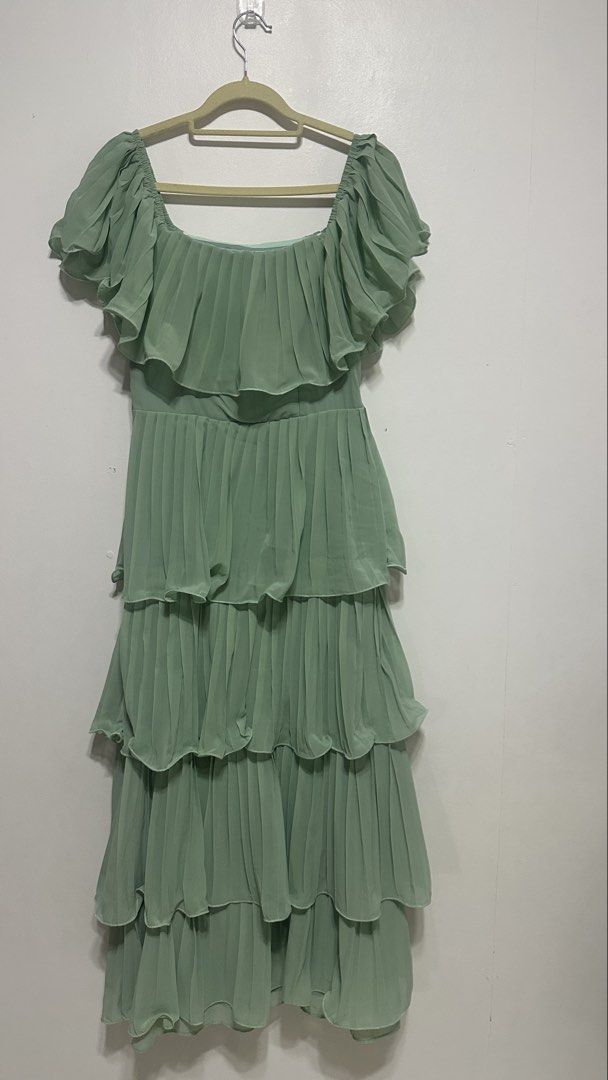 Sage Green Ruffle Dress (Category: Evening dresses & gowns) located in Quezon City. Submitted by shop.wildfactorieph (Listing ID 1470387037, Image 1). Description: Shein Premium Used once for a wedding and after got stocked nalang in the cabinet. My waistline is 30-31 Has double linings Perfect for airconditioned events.