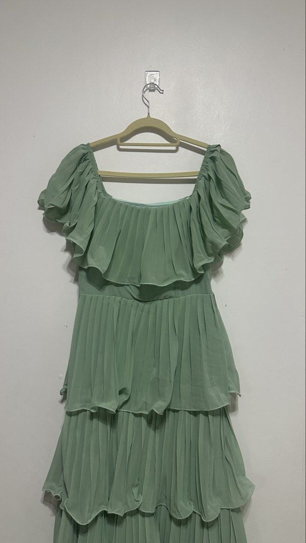 Sage Green Ruffle Dress (Category: Evening dresses & gowns) located in Quezon City. Submitted by shop.wildfactorieph (Listing ID 1470387037, Image 3). Description: Shein Premium Used once for a wedding and after got stocked nalang in the cabinet. My waistline is 30-31 Has double linings Perfect for airconditioned events.