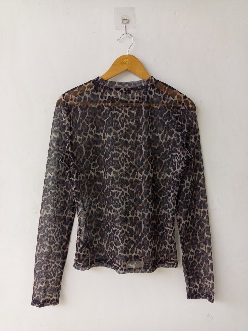 Saint Laurent Sheer Leopard-print Long Sleeve Mesh Top (Category: Longsleeves) located in Surallah. Submitted by miggyboiy (Listing ID 1470494342, Image 2). Description: Saint Laurent Sheer Leopard-print Long Sleeve Mesh Top 18.5x24 sleeve 27.5 9.8 color rate Like new condition No issues Location: Surallah, South Cotabato, Mindanao, 9512 📌.