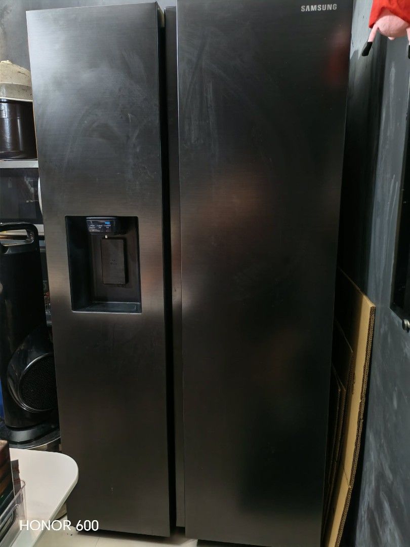 Samsung Side by Side Refrigerator Black (Category: Refrigerators and Freezers) located in Malabon City. Submitted by cbpreloveditems (Listing ID 1470383790, Image 1). Description: - Brand/Model: Samsung Side-by-Side Refrigerator - Color: Sleek Black Finish - Features: Door water and ice dispenser, All-Around Cooling system - Interior: Spacious with multiple glass shelves and door bins - Dimensions: 912mm (W) x 1780mm (H) x 716mm (D) - Condition: 