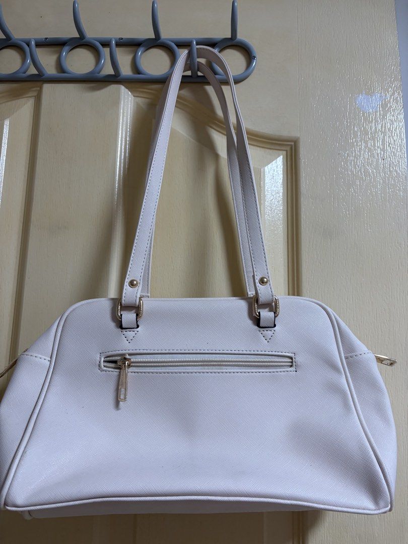 Secosana White shoulder bag with heart pocket (Category: Shoulder Bags) located in Quezon City. Submitted by arinscart (Listing ID 1470504656, Image 2). Description: Condition: Some small scuff marks near the top and zipper area visible in close-up photos. Used once for a concert lang 😊 MOP: GCash, Maribank, BPI MOD: J&T, SDD LOC: QC .