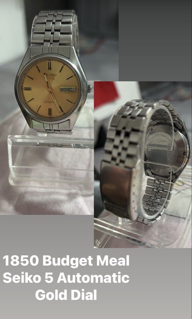Seiko 5 Automatic Gold Dial Watch (Category: Men's Watches) located in Manila. Submitted by trishea.321 (Listing ID 1470517514, Image 1). Description: - Vintage Seiko 5 automatic watch - Striking textured gold dial - Stainless steel case with jubilee-style bracelet - Convenient day and date display at 3 o'clock - Automatic mechanical movement with exhibition case back - Keeps good time - Minor surface scratches on case and bracelet from regular w