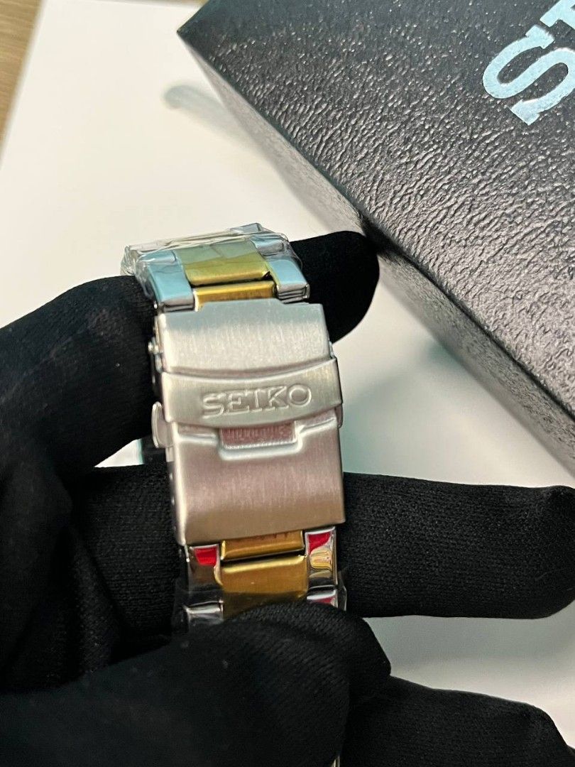 Seiko Prospex GMT Automatic Diver's 200M Two-Tone Watch (Category: Men's Watches) located in Manila. Submitted by seannathan46011 (Listing ID 1470496265, Image 2). Description: Brand new Seiko Prospex Automatic GMT watch. Features a black dial, gold accents, 200M water resistance, and a two-tone bracelet still in protective plastic. Comes with the original Seiko box. Perfect daily driver or luxury gift!.