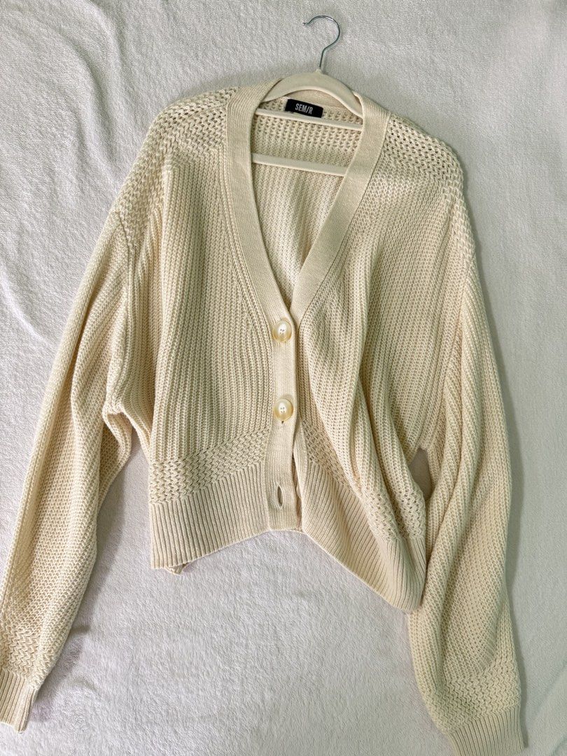 SEM/R Cream Knit Cardigan (Category: Coats, Jackets and Outerwear) located in Manila. Submitted by mmilaomls (Listing ID 1470410312, Image 1). Description: - Brand: SEM/R - Color: Versatile neutral cream - Style: V-neck, chunky knit with tortoise-style front buttons - Fit: Relaxed, slightly cropped with ribbed cuffs and hem - Perfect for: Easy layering during cooler weather.