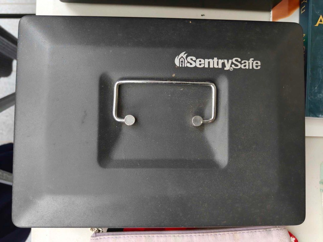 SentrySafe Black Cash Box With Removable Tray (Category: Safe) located in Antipolo. Submitted by tagsale101 (Listing ID 1470461095, Image 1). Description: - Brand: SentrySafe - Color: Classic black - Material: Sturdy metal construction - Security: Key lock on front panel (includes 2 keys in sealed bag) - Tray: Removable gray plastic tray with 6 coin and bill compartments - Storage: Extra space underneath the tray for receipt or document storage -