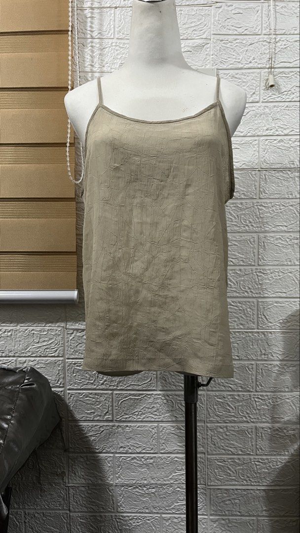 Sheer Beige Spaghetti Strap Camisole Tank Top (Category: Sleeveless) located in Cavite. Submitted by aureabiazon (Listing ID 1470360854, Image 1). Description: Size: Medium Disclaimer: Needs Inner because it’s see through MOP: gcash MOD: j&t or lalamove (sf shouldered by buyer) pm nalang po for more info🤗💗.