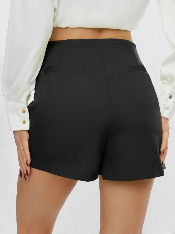 SHEIN | Black high-waisted wrap shorts skort STRETCHABLE (Category: Shorts) located in Angeles City. Submitted by cyleen (Listing ID 1470386201, Image 2). Description: - Color: Solid black - Style: High-waisted with asymmetrical wrap waistband - Design: Skirt layer on top with shorts underneath for full coverage - Details: Clean tailored look with back faux pocket welts - Closure: Easy side/back zipper - Fabric: Comfortable, structured, and holds