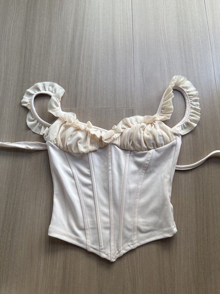SHEIN beige corset (Category: Sleeveless) located in Manila. Submitted by bella_boo (Listing ID 1470433968, Image 1). Description: with adjustable straps have to sell by TUESDAY tags 🏷️ brandy melville subdued cotton on bershka stradivarius zara pull n bear hnm edikted.
