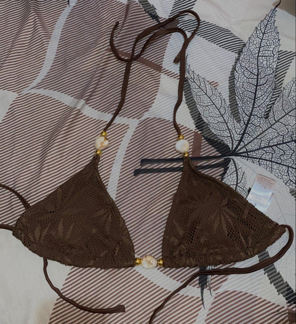 SHEIN Brown Crochet Shell Beaded Triangle Bikini Set Small (Category: Bikinis & Swimsuits) located in Manila. Submitted by katangiii (Listing ID 1470516976, Image 2). Description: - Brand: SHEIN - Item: Brown bikini set (triangle top and matching bottoms) - Size: Small - Accents: White marbled beads and gold spacers on straps and center front - Condition: Brand new with tags, in original ziplock packaging.