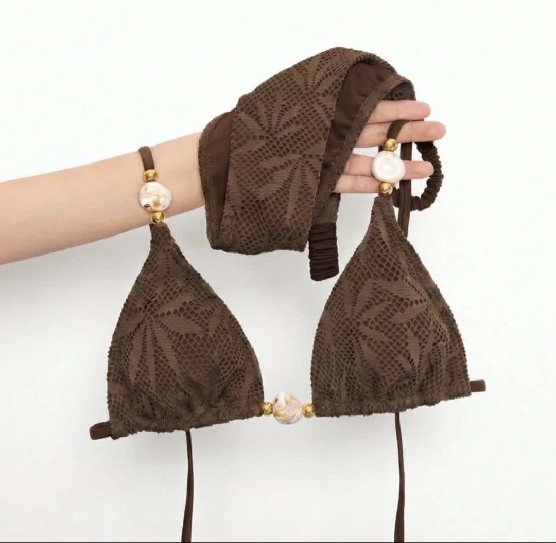 SHEIN Brown Crochet Shell Beaded Triangle Bikini Set Small (Category: Bikinis & Swimsuits) located in Manila. Submitted by katangiii (Listing ID 1470516976, Image 1). Description: - Brand: SHEIN - Item: Brown bikini set (triangle top and matching bottoms) - Size: Small - Accents: White marbled beads and gold spacers on straps and center front - Condition: Brand new with tags, in original ziplock packaging.