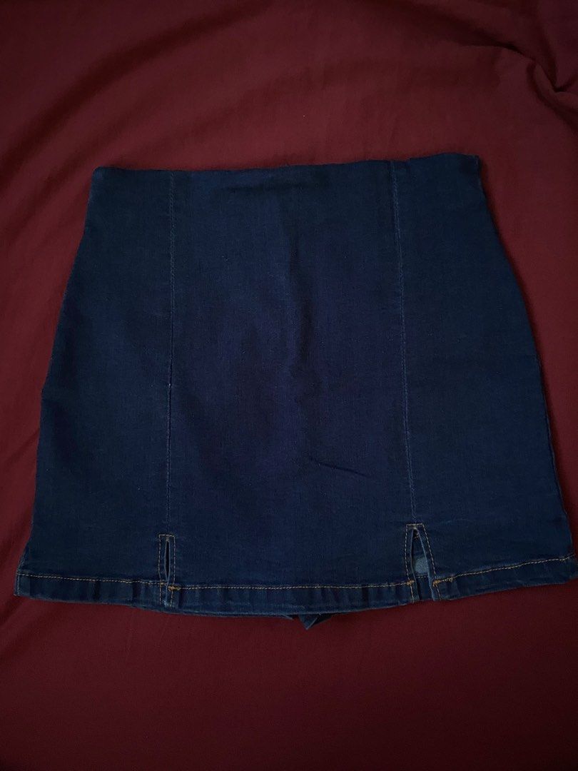 SHEIN Denim Skirt STRETCHABLE (Category: Skirts) located in Manila. Submitted by love_mami (Listing ID 1470450267, Image 1). Description: - Brand: SHEIN - Color: Dark blue wash - Size: M (Tag: 170/70B) 27-28 waist - Design: Front seams with small slit details near the hem - Material: Cotton blend with a bit of stretch for comfort - Care: Machine washable.