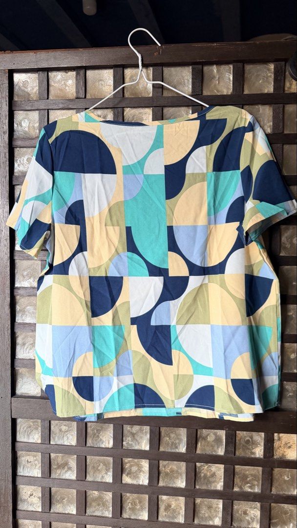 SHEIN LUNE Geometric Pattern Short Sleeve Blouse Size M (Category: Blouses) located in Makati City. Submitted by rocelli28 (Listing ID 1470455371, Image 3). Description: - Brand: SHEIN LUNE - Style: Geometric print color block blouse with round neckline and short sleeves - Colors: Navy blue, teal, pastel yellow, light blue, and white - Size: M (EU 38, US 6) - Material: Smooth, comfortable, lightweight fabric.