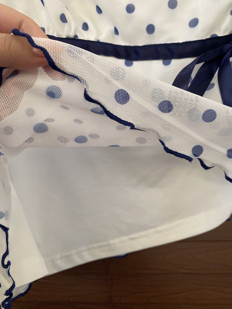 Shein White Blue Polka Dot Mesh Tank Top (Category: Sleeveless) located in Dasmarinas. Submitted by closetcleanser_ (Listing ID 1470430799, Image 2). Description: Shein white tank top with blue polka dots, size L with a solid white lining, a cute navy blue ribbon tie at the waist Please note: there is a light yellow discoloration near the right shoulder strap seam. Still a lovely piece for casual wear hehe.