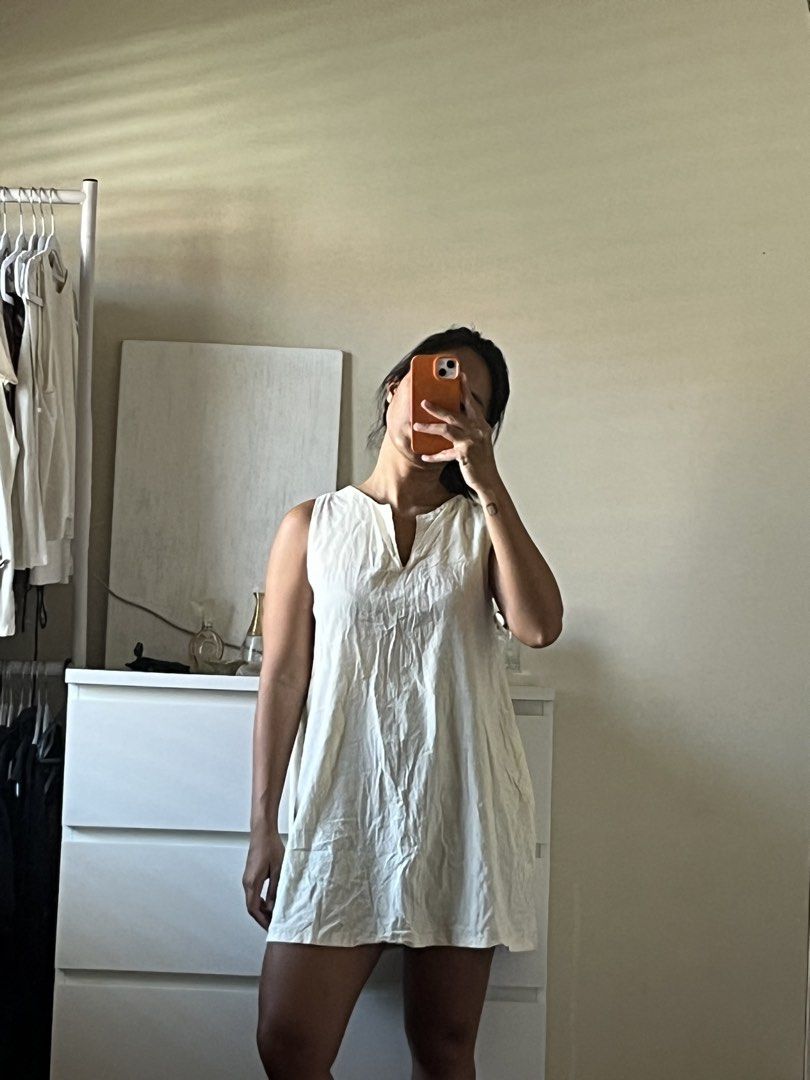 Short Dress (Category: Dresses) located in Taytay. Submitted by prelovedbyblaire (Listing ID 1470392194, Image 2). Description: - Cream sleeveless mini dress - Lightweight, breathable fabric - Simple V-neckline - Straight, loose fit - Mid-thigh length - Easy slip-on style for warm weather.