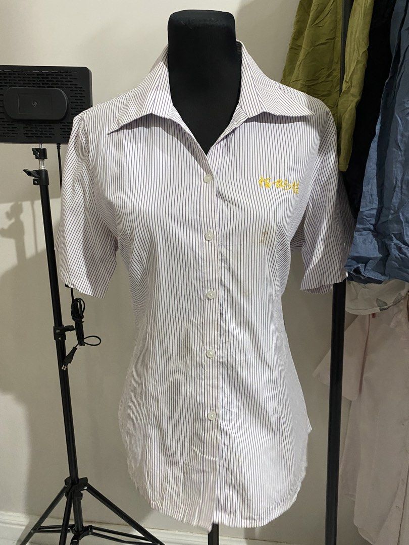 Short Sleeve Striped Button Down Shirt with Embroidery (Category: Shirts) located in Manila. Submitted by mpt99876 (Listing ID 1470496276, Image 1). Description: - Style: Short sleeve button-down shirt - Design: Blue and white vertical stripes with a pointed collar and white front buttons - Detail: Yellow embroidered text on the left chest - Fit: Regular fit, lightweight fabric - Ideal for: Everyday casual wear.