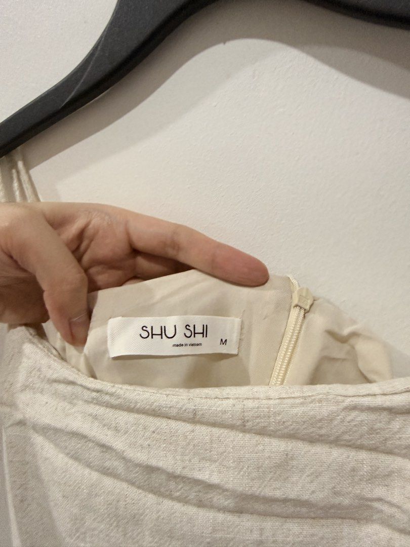 Shu Shi Linen Dress (Category: Dresses) located in Makati City. Submitted by prelovedclothes.m (Listing ID 1470467736, Image 3). Description: - Color: Neutral cream - Material: Classic lightweight linen texture - Design: Spaghetti straps, square neckline, and fitted bodice - Fit: Flowy long skirt reaching ankle length.
