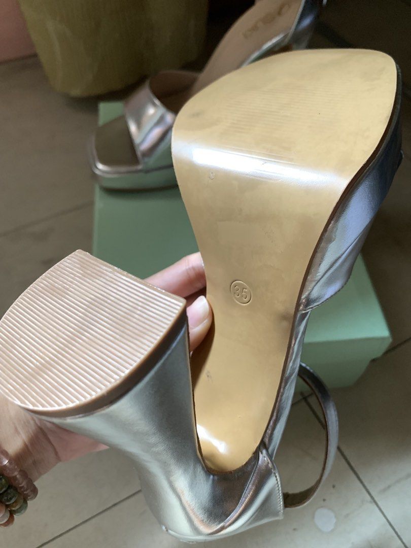 Silver Heels with strap (Category: Heels) located in Manila. Submitted by whimsy.finds (Listing ID 1470381242, Image 3). Description: Bought it in mall Rfs: size too much small for me No issue With box and dustbag Size 35 Payment first basis via Gcash / Maribank / Maya Ship via Lalamove ONLY .
