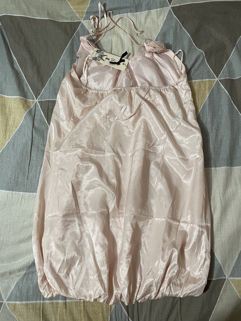 Dress Vietnam style (Category: Dresses) located in Taytay. Submitted by roxanne_03 (Listing ID 1470350399, Image 3). Description: super pretty when worn - Brand: Silvian Heach - Condition: Brand new with original tags attached - Size: XL - Color: Pastel Pink - Material: Smooth satin fabric with a subtle sheen - Design: Halter neck tie-up, adorable rosette details on the neckline, and a playful gathered bubble hem super pretty when worn and in per