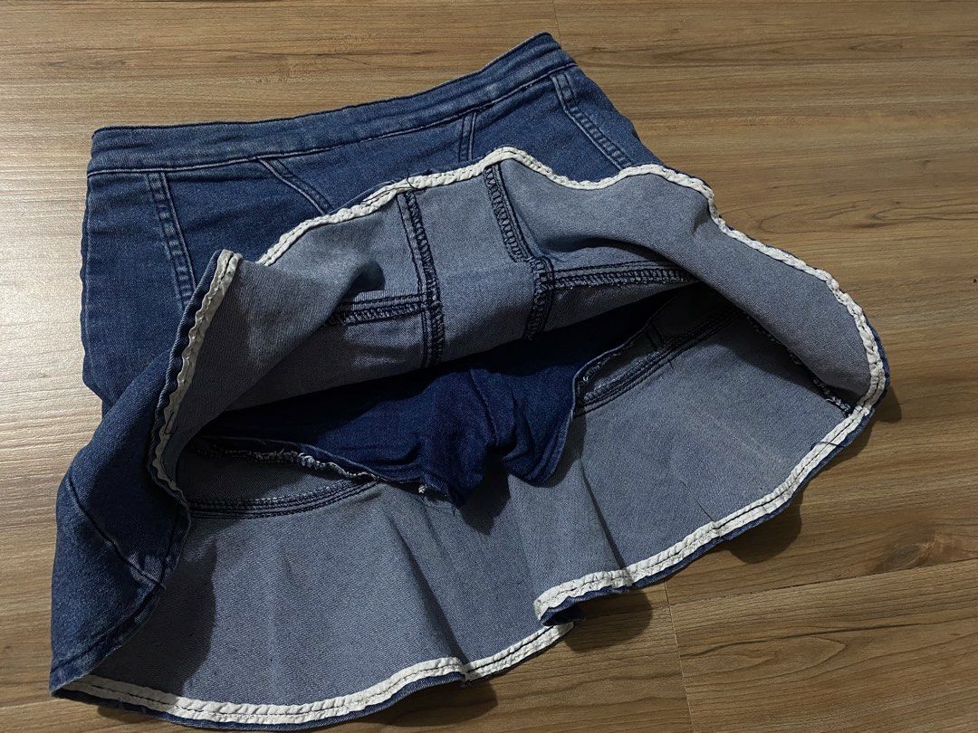 Skort 26"-30" length 15.5" (Category: Skirts) located in Bulacan. Submitted by Spothings (Listing ID 1470520877, Image 3). Description: - Trendy blue denim skort with a playful flounce ruffle hem - Built-in shorts underneath for extra coverage and confidence - Secure front center zipper closure with structured panel stitching - Classic medium wash denim fabric that is easy to pair with any top - Comfortable and stylish, perfect for casual days ou