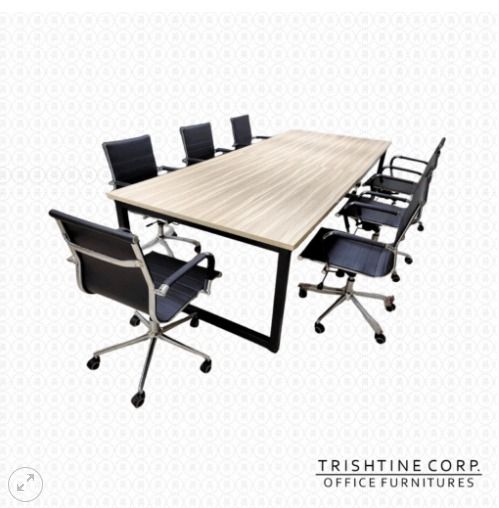 Sleek Modern Conference Table (Category: Tables & Sets) located in Caloocan City. Submitted by jim.trishtineofficefurnitures (Listing ID 1470437266, Image 1). Description: - Brand: Trishtine Corp Office Furnitures - Set includes: 1 conference table + 7 matching black rolling executive chairs - Design: Light woodgrain top with sturdy black metal legs - Ideal for: Meeting rooms or large home offices - Condition: Good, sturdy build and clean look - 
