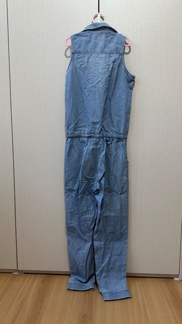 Sleeveless Light Blue Denim Jumpsuit with Drawstring Waist (Category: Jumpsuits) located in Cavite. Submitted by bravesoul99 (Listing ID 1470441422, Image 2). Description: Size 12 on tag fits 7-8yo - Color/Material: Light blue soft denim, easy to slip on - Design: Sleeveless, button-down front with metal hardware - Fit: Adjustable drawstring waist for a flattering shape - Pockets: Two chest pockets (with cute embroidered flower on the left) plus 