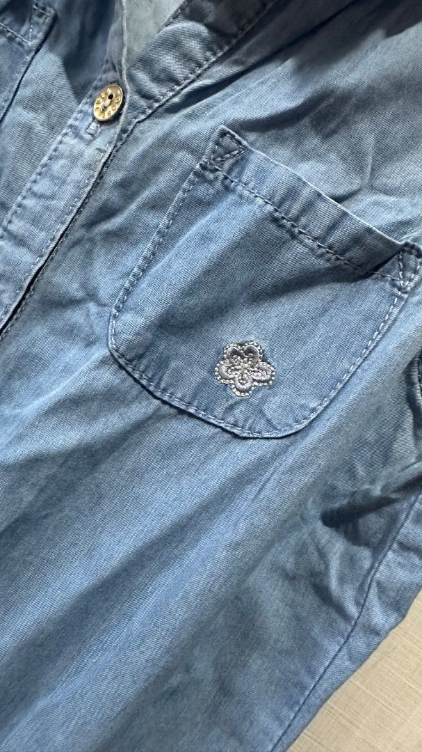 Sleeveless Light Blue Denim Jumpsuit with Drawstring Waist (Category: Jumpsuits) located in Cavite. Submitted by bravesoul99 (Listing ID 1470441422, Image 3). Description: Size 12 on tag fits 7-8yo - Color/Material: Light blue soft denim, easy to slip on - Design: Sleeveless, button-down front with metal hardware - Fit: Adjustable drawstring waist for a flattering shape - Pockets: Two chest pockets (with cute embroidered flower on the left) plus 