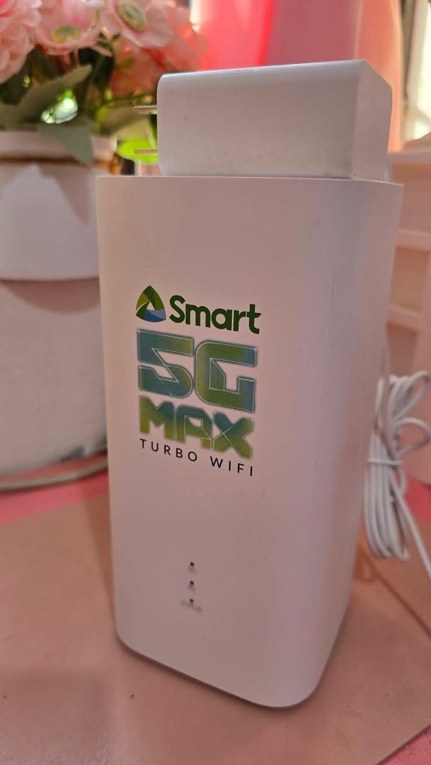 Smart 5G Max Turbo Wifi Router White (Category: Networking) located in Caloocan City. Submitted by kennanmanalo (Listing ID 1470416137, Image 1). Description: - Model: Smart 5G Max Turbo Wifi (White) - Condition: Clean body with minimal scuffs - Design: Compact tower with front status indicator lights - Inclusion: Original power adapter plug included - Setup: Ready to connect, just insert your active SIM card.