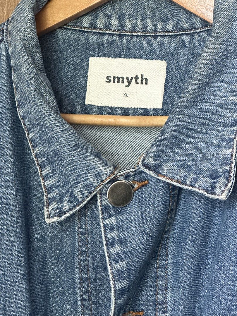 Smyth Oversized Raw Hem Denim Jacket (Category: Coats, Jackets and Outerwear) located in Mandaluyong City. Submitted by fourleafcloverrrr (Listing ID 1470360038, Image 3). Description: Product Details: Brand: Smyth Size: Extra Large (XL) Fit: Oversized / Drop-Shoulder Color: Medium Blue Denim Wash Design Features: Raw distressed frayed hem at the bottom Custom Smyth metal shank buttons Two front chest flap pockets + side hand pockets Buttoned cuf