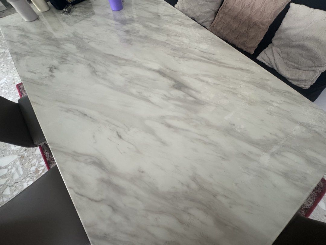 Solid Marble Dining Table (Category: Tables & Sets) located in Singapore. Submitted by jetadourz (Listing ID 1470381836, Image 2). Description: - Purchased at $1999 - Dimensions: 160x90x75cm - Solid Marble Table Top - Elegant rectangular dining table with white/grey marble pattern top - Table top protected with plastic since purchase - Ideal setup for daily dining and hosting guests - Self-pick up only; buyer to arrange own transport from Simei -