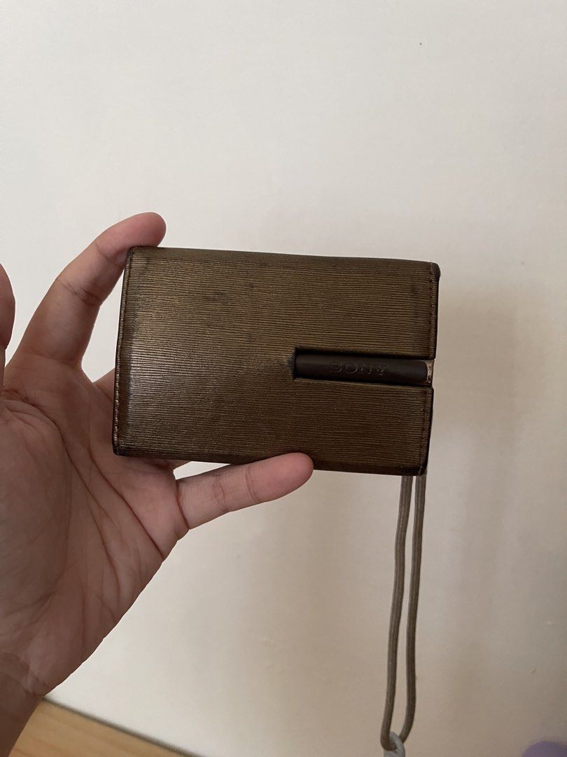 Sony Cyber-shot DSC-TX1 Digital Camera Gold (Category: Cameras) located in Matanao. Submitted by juiys (Listing ID 1470381817, Image 3). Description: 🎀 FOR SALE: ₱1,500 | Sony Cyber-shot DSC-TX1 📸 Vintage digicam with cute accessories! 💗 ⚠️ ISSUE: TOUCHSCREEN NOT WORKING / NOT RESPONSIVE. The camera has been stored unused (tambak) for a long time. Exact cause is unknown and has not been checked or repaired. INCLUSIONS: ♡ Sony Cyber-shot TX1 ♡ 
