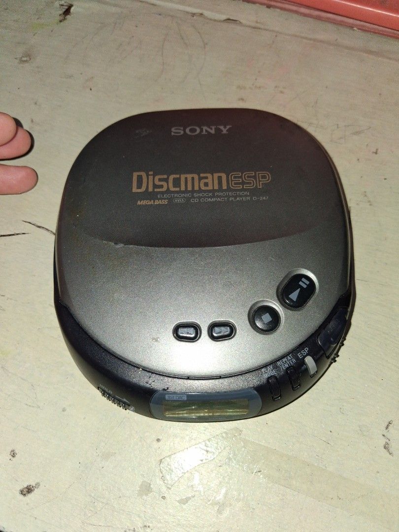 Sony Discman ESP D-247 Portable CD Player (Category: Portable Music Players) located in Manila. Submitted by marcas022798212 (Listing ID 1470351567, Image 1). Description: - Vintage Sony Discman D-247 (Grey & Black) - Refurbished unit with original bottom sticker - Mega Bass & Electronic Shock Protection (ESP) - Powered by 2 AA batteries - Tested and working, shows normal scuffs from age.
