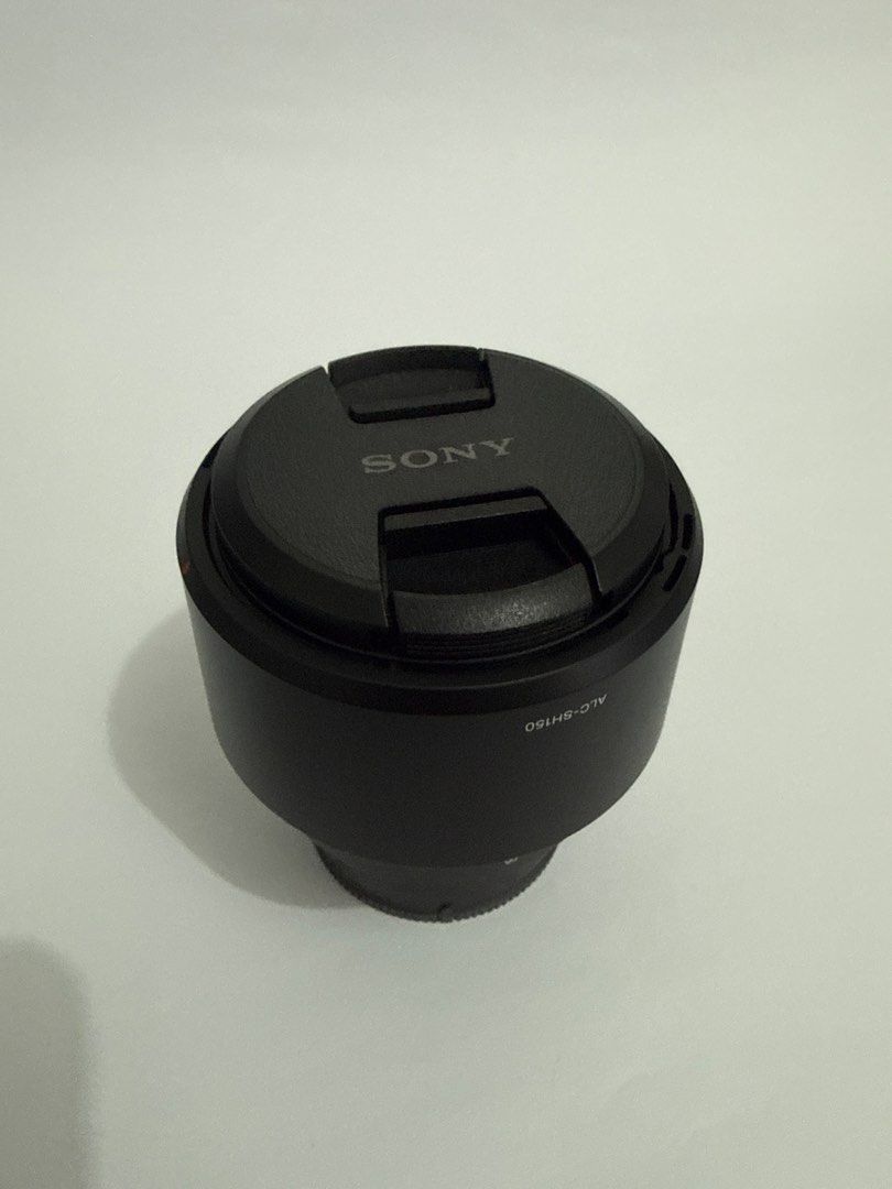 Sony FE 85mm F1.8 E-mount Lens (Category: Lens & Kits) located in Manila. Submitted by petey._ (Listing ID 1470498304, Image 3). Description: - Sony FE 85mm f/1.8 prime lens (Full-frame E-mount) - Pristine glass with zero marks on the body - Features built-in focus hold button and AF/MF switch - Includes original box, front and rear caps, lens hood, and manuals - Matching serials/model number (SEL85F18) -Pristine condition - with receipt - no scr
