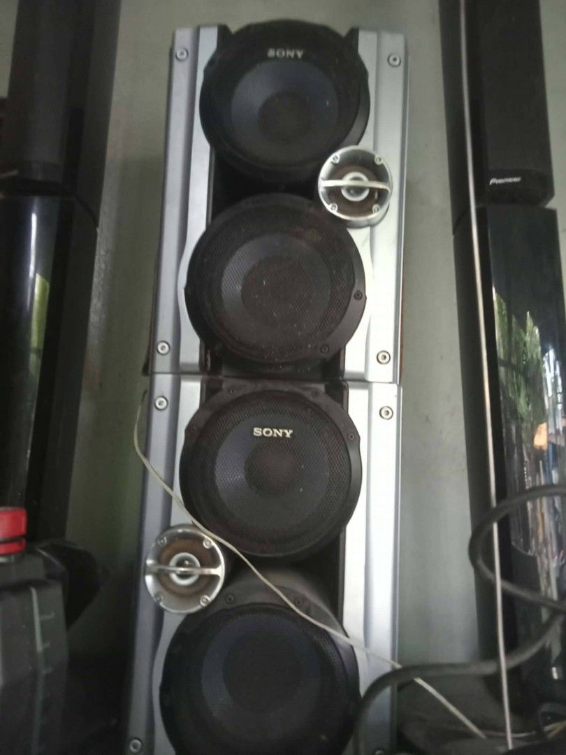 Sony tower speakers (Category: Soundbars, Speakers & Amplifiers) located in Manila. Submitted by wisegem-231b (Listing ID 1470451002, Image 2). Description: - Brand: Sony - Type: Heavy-duty tower speaker system - Color/Finish: Silver and black with exposed cones and built-in tweeters - Condition: Tested and working fine (dusty from storage) - Inclusions: Wires included - Features: Great sound output, perfect for home audio setups.